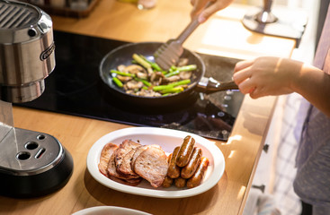 Female cooking breakfast on kitchen counter bar.Healthy food,simple eating
