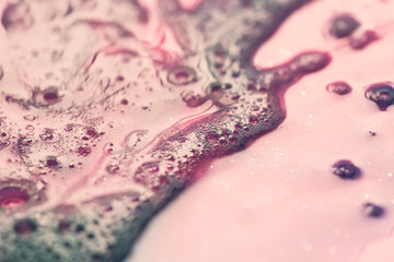 macro shot of pink soap foam texture, abstract background
