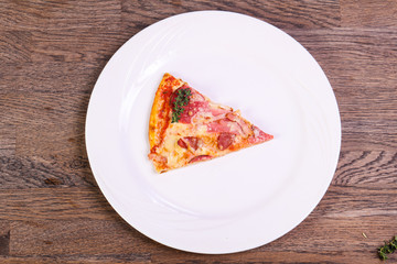 Pizza with ham and sausages