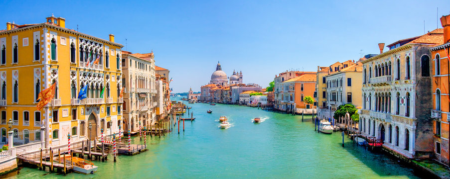 Panorama of Grand Canal and Basilica Santa Maria della Salute in Venice, Italy. Architecture and landmarks of Venice and Italy. Beautiful  landscape of Grand Canal in Venice, Italy