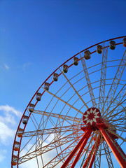 Partly visible ferris wheel at sunset