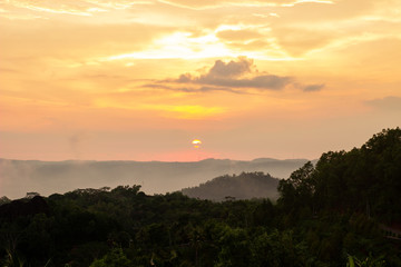 The sunset on Purba Volcano Mountain,Mount Api Purba. one of the tourist destination in Gunungkidul, Yogyakarta, Indonesia.