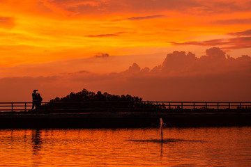 Fototapeta na wymiar Sunset in Lake Nglanggeran / Embung Nglanggeran, a lake that holds rainwater at a height, Gunungkidul, Yogyakarta.