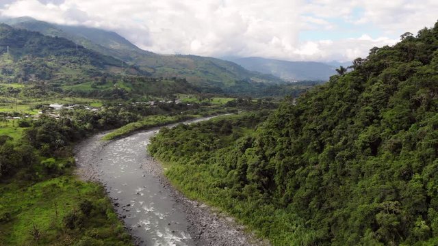 Rising above the Rio Quijos Valley, a tributary of the Amazon in Ecuador, view downstream showing the Baeza-Lago Agrio road and areas cleared for cattle pasture.