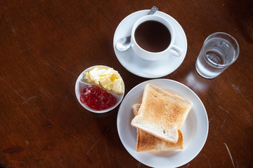 Breakfast in the morning slices toast, butter and jam