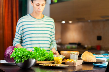 Girl prepares a vegetarian recipe in the kitchen
