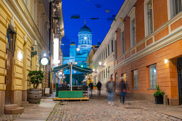 Helsinki. Finland. Suurkirkko. Cathedral Of St. Nicholas. Cathedrals Of Finland. The street leads to Helsinki Senate square. Streets Of Helsinki. Architecture. White Church with dark domes.