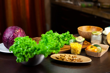 Sauerkraut, lettuce, dried fruit and corn on the kitchen table