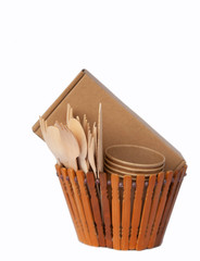 Crockery made from eco kraft paper, paper cups, dishes, bag, fast food containers isolated on white background. Recycling concept. Zero waste. Close-up...