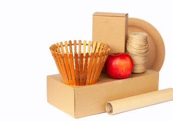Crockery made from eco kraft paper, paper cups, dishes, bag, fast food containers isolated on white background. Recycling concept. Zero waste. Close-up...
