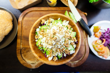 Wooden bowl with stuffed salad