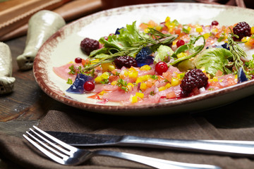 fish appetizer with fresh berries