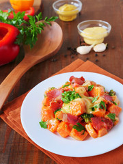 Sweet potato salad with homemade creamy honey-mustard mayo dressing on plate, vertical