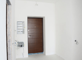 House metal entrance door with mounted open electric meter box with residual current device or RCD