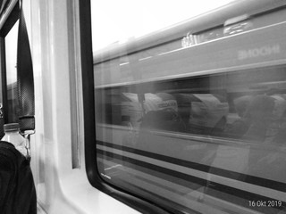 The view of an oncoming train is seen from the train
