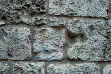 Fondo de pared de piedra gris de un edificio antiguo.