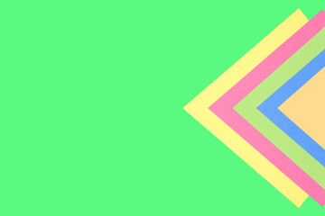 Colored triangles on a green background.