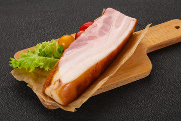 Smoked pork breast with salad leaves