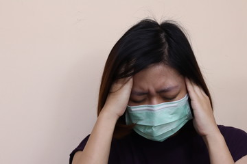 coronavirus concept. Asian woman wearing protective masks coughing, sneezing and headaches and has a stuffed nose or runny nose and has a fever. Novel coronavirus (2019-nCoV)