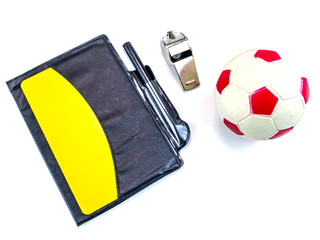 Soccer ball and yellow card with the whistle of a soccer referee on a white background. Football....