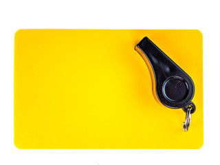 Yellow card and whistle of a football referee on a white background. Football. Championship. World....