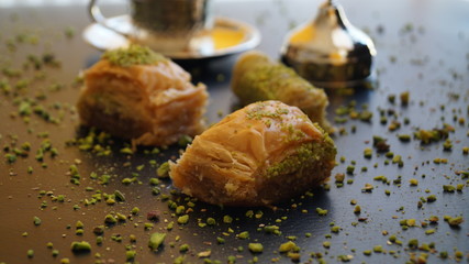 traditional turkish sweet - baklava and turkish coffee on a black background