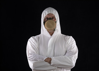 man in gas mask and in white overalls
