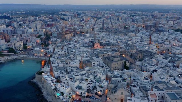 Flight over Monopoli during blue hour, Apulia, Italy