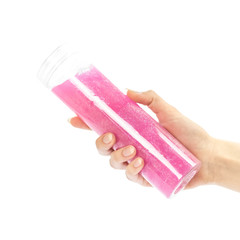 Hand holding a pink slime. Close up. Isolated on a white background