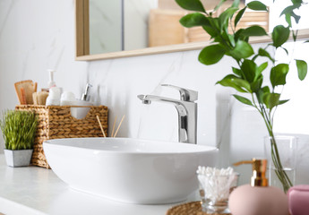 Fototapeta na wymiar Modern vessel sink with faucet in stylish bathroom