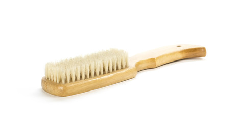 Brush with wooden handle. Close up. Isolated on a white background