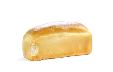 A bitten loaf of bread. A half-eaten loaf of bread. Close up. Isolated on a white background
