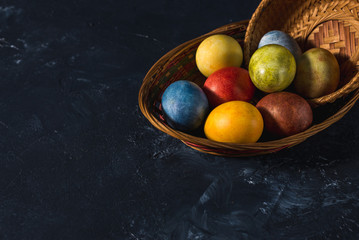 Multi-colored bright easter eggs. Easter. Easter eggs on a dark background Easter background....