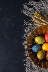Multi-colored bright easter eggs. Easter. Easter eggs on a dark background Easter background....