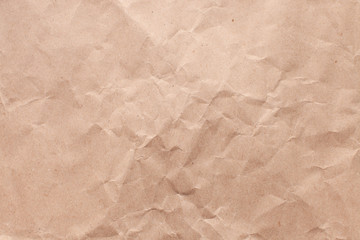 Obraz premium Texture of old rough recycled Kraft brown paper with creases