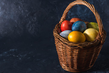 Multi-colored bright easter eggs. Easter. Easter eggs on a dark background Easter background. Easter symbol Easter greetings Christ is risen Copyspace close-up