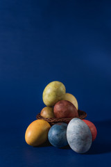  Multi-colored bright easter eggs. Easter. Easter eggs on a dark blue background Easter background. Easter symbol Easter greetings Christ is risen Copyspace close-up