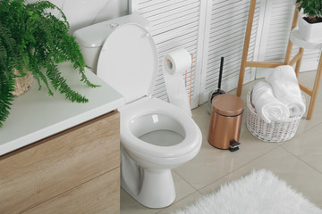 Stylish toilet bowl in modern bathroom interior