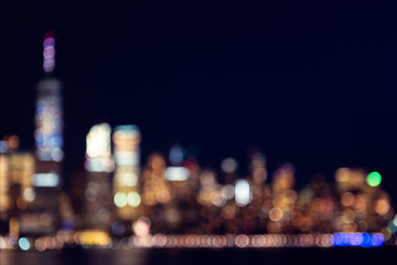 Amazing panorama view on New York City skyline and Downtown Manhattan from Jersey City during night. Defocused background image