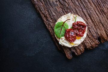 sun-dried tomatoes, sandwich appetizer snack (bruschetta) menu concept. background. top view. copy...