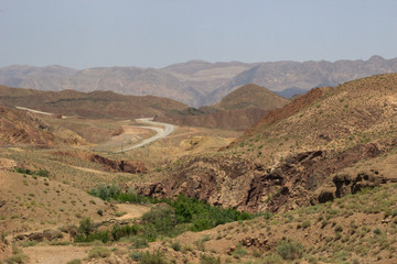 Desert landscape with rocks and geological formations on a hot summer day on the road from Kerman to Mashhad.