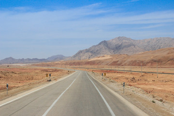 Desert landscape with rocks and geological formations on a hot summer day on the road from Kerman to Mashhad.