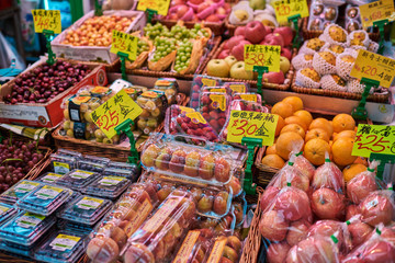 Stall of organic vegetables and fruits at a farmers market. Selling organic fresh agricultural product at farmer market.