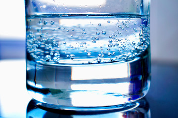 glass of water on blue background