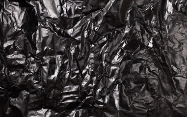 Background texture of a polyethylene shiny black film