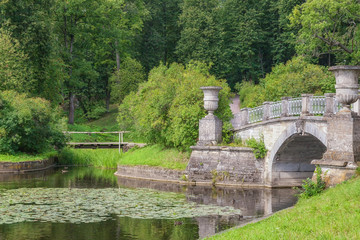 Picturesque alleys and bridges are the best place for hiking in the park of the Pavlovsk Palace, St. Petersburg, Russia