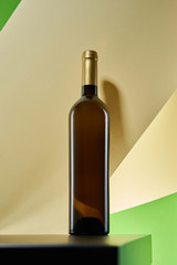 Wine bottle on artistic paper background