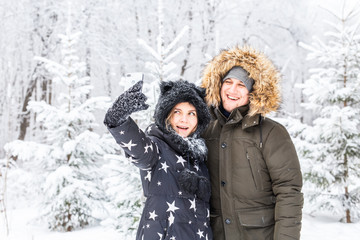 Man taking selfie photo young romantic couple smile snow forest outdoor winter