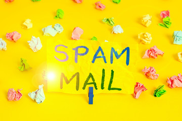 Handwriting text writing Spam Mail. Conceptual photo Intrusive advertising Inappropriate messages sent on the Internet Colored crumpled papers empty reminder white floor background clothespin