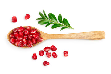 pomegranate seeds in wooden spoon isolated on white background with clipping path and full depth of...